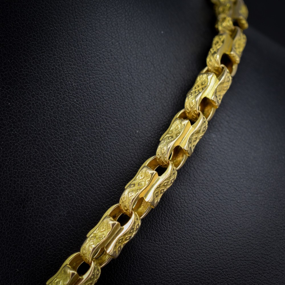 An antique 10ct yellow gold tulip link chain necklace featuring textured engraved links and a swivel dog clip clasp. View IV