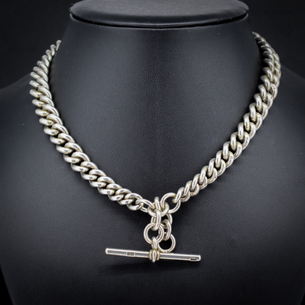 An antique sterling silver Albert watch chain featuring heavy curb links, double swivel clasps, and a central T-bar attachment. View II