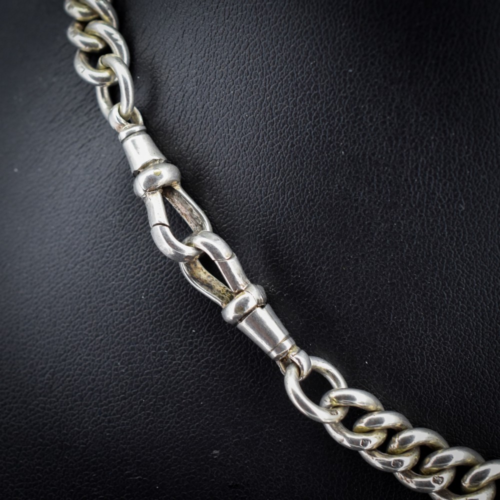 An antique sterling silver Albert watch chain featuring heavy curb links, double swivel clasps, and a central T-bar attachment. View IV