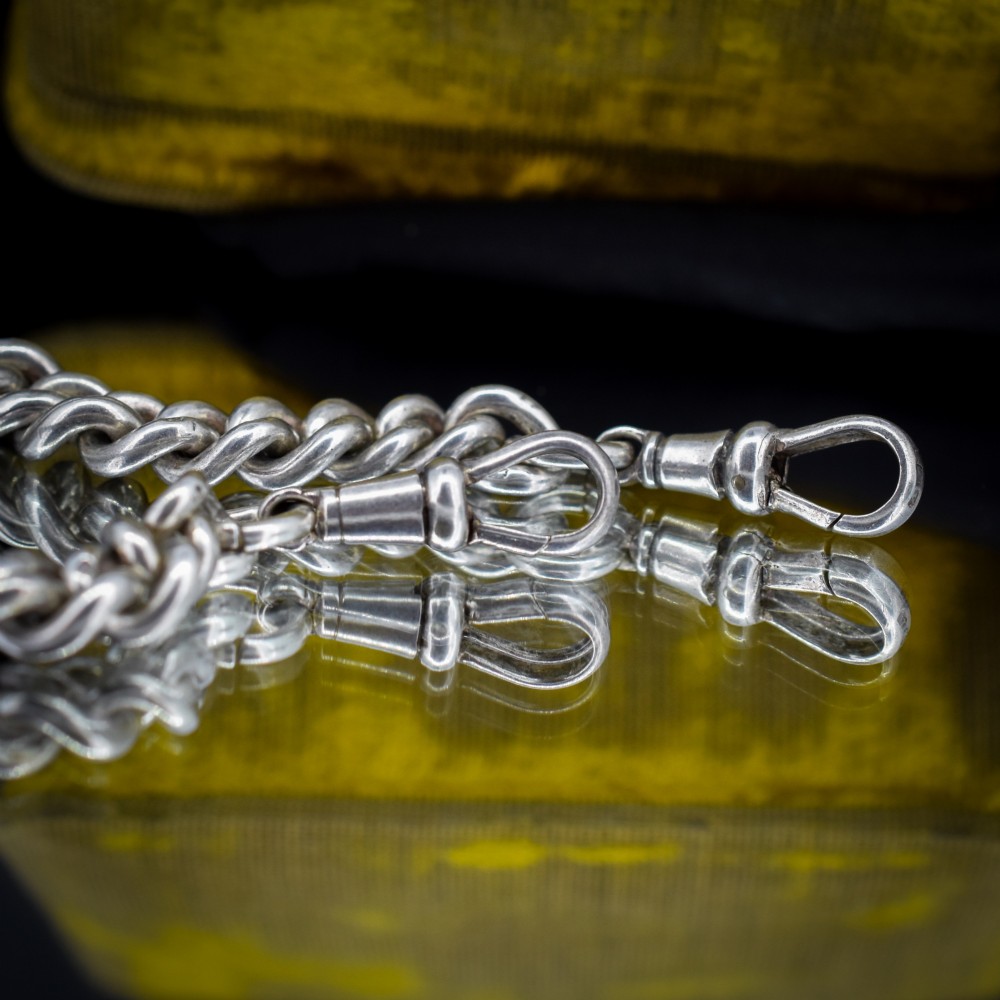 An antique sterling silver Albert watch chain featuring heavy curb links, double swivel clasps, and a central T-bar attachment. View VI
