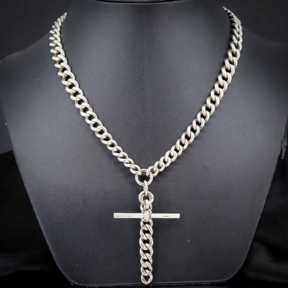 An antique sterling silver curb link Albert chain featuring a central T-bar attachment and double dog clip clasps. View II