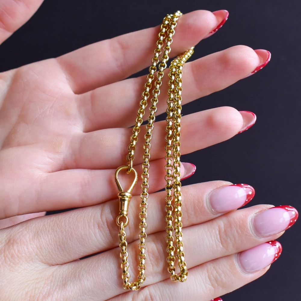 An antique Victorian 9ct yellow gold belcher link chain necklace featuring a dog clip clasp fastener. View IX