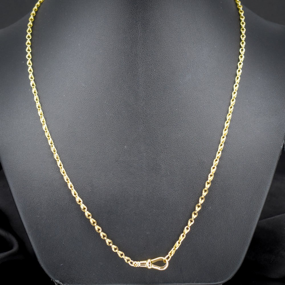An antique yellow gold twenty-inch chain necklace featuring love knot links and a functional swivel dog clip fastener. View II