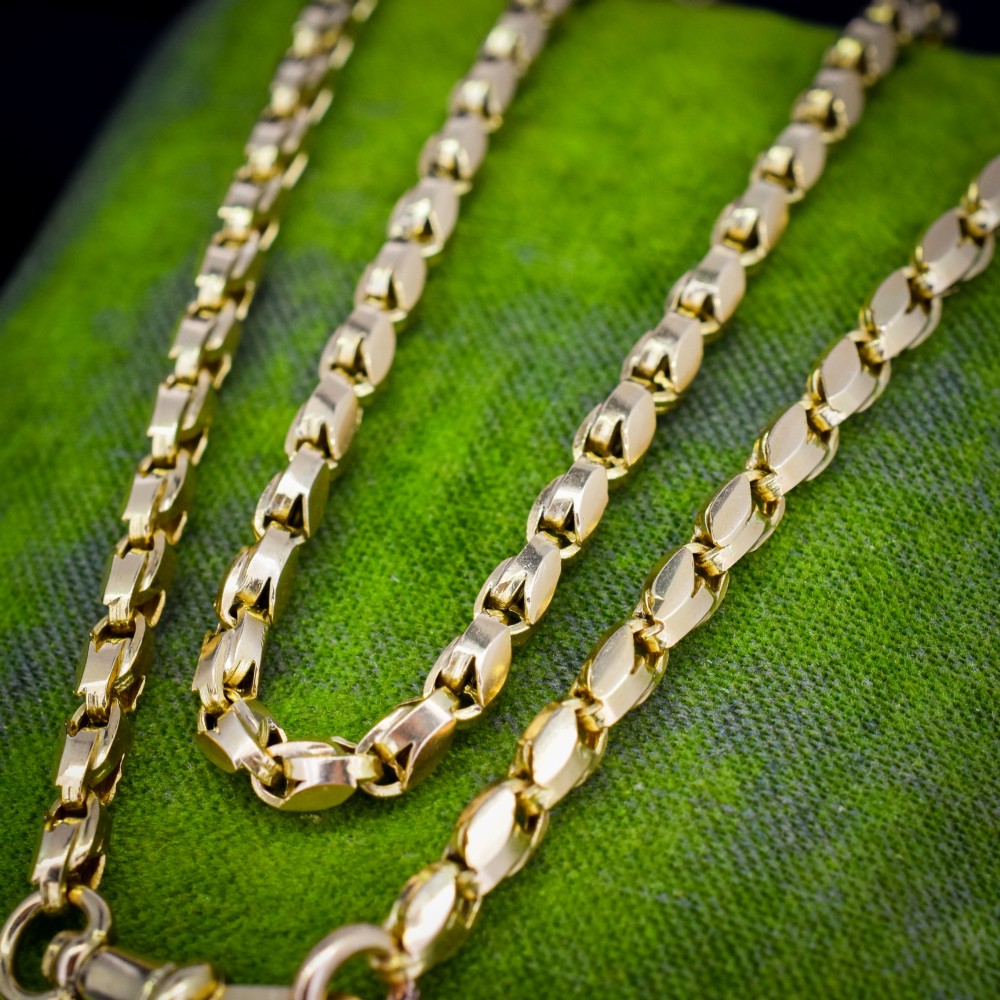 An antique 9ct yellow gold tulip link fancy chain necklace featuring a traditional dog clip fastener. View VI