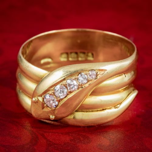 fig 2. An Art Deco yellow gold coiled snake ring set with five diamonds along the head, featuring visible internal hallmarks.