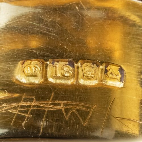 fig 3. An Art Deco yellow gold coiled snake ring set with five diamonds along the head, featuring visible internal hallmarks.