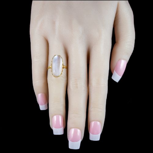 fig 1. An antique Victorian ring featuring a large oval cabochon moonstone set in a multi-claw yellow gold mounting.