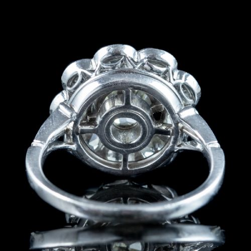 fig 2. An Edwardian platinum ring featuring a large old European cut central diamond surrounded by nine round diamonds forming a daisy cluster.