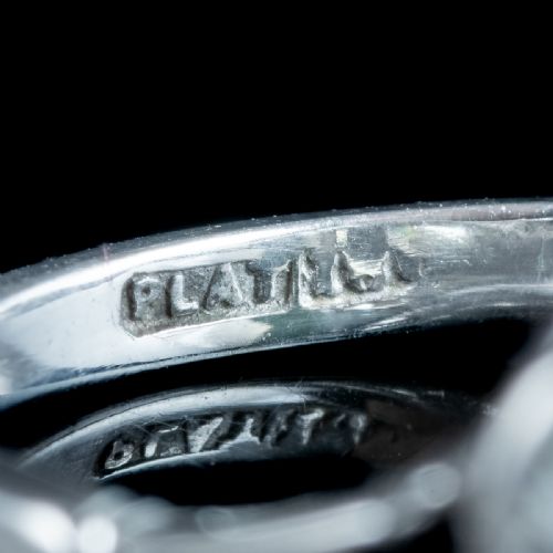 fig 4. An Edwardian platinum ring featuring a large old European cut central diamond surrounded by nine round diamonds forming a daisy cluster.