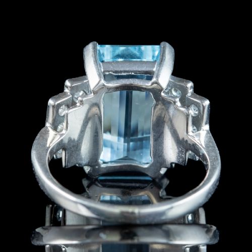 fig 2. A vintage 1950s cocktail ring featuring a large emerald-cut blue aquamarine flanked by stepped shoulders set with round diamonds.