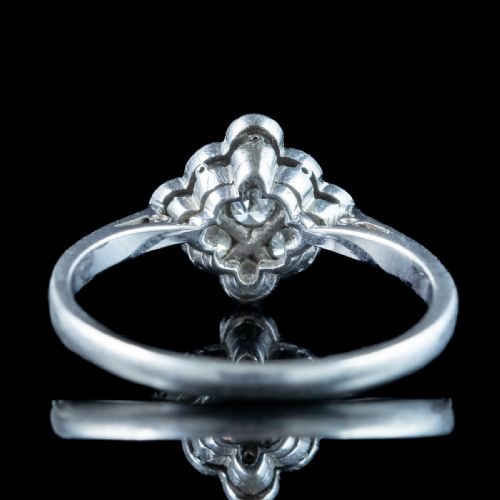 fig 1. An Edwardian diamond cluster ring featuring old cut diamonds set in a milgrain-bordered quatrefoil pattern in platinum.