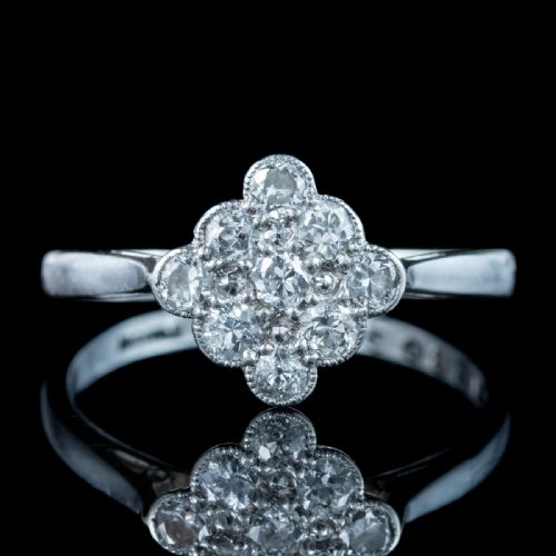 fig 2. An Edwardian diamond cluster ring featuring old cut diamonds set in a milgrain-bordered quatrefoil pattern in platinum.