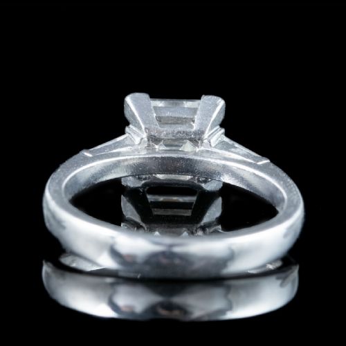 fig 1. An Art Deco platinum ring featuring a central square step-cut diamond flanked by two tapered baguette diamonds.