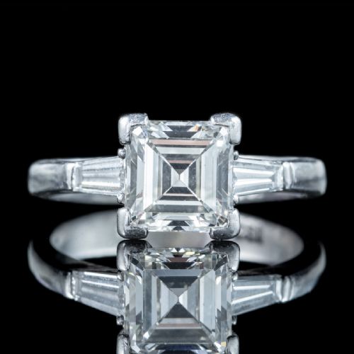 fig 2. An Art Deco platinum ring featuring a central square step-cut diamond flanked by two tapered baguette diamonds.
