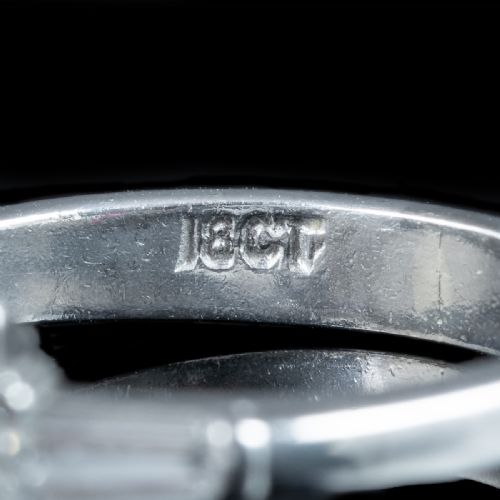 fig 4. An Art Deco platinum ring featuring a central square step-cut diamond flanked by two tapered baguette diamonds.