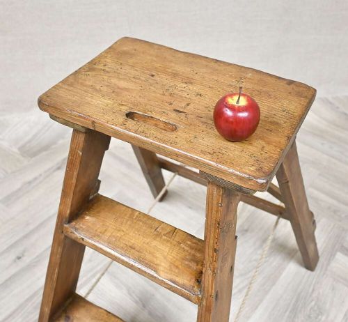 A short folding pine step ladder with three treads, a flat top step, and a rope support brace. View VI