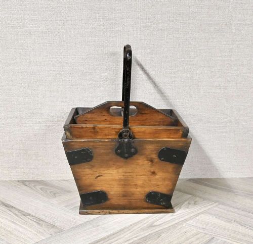 A tapered rectangular wooden housekeepers bucket with iron corner brackets, internal dividers, and a tall metal swing handle. View V
