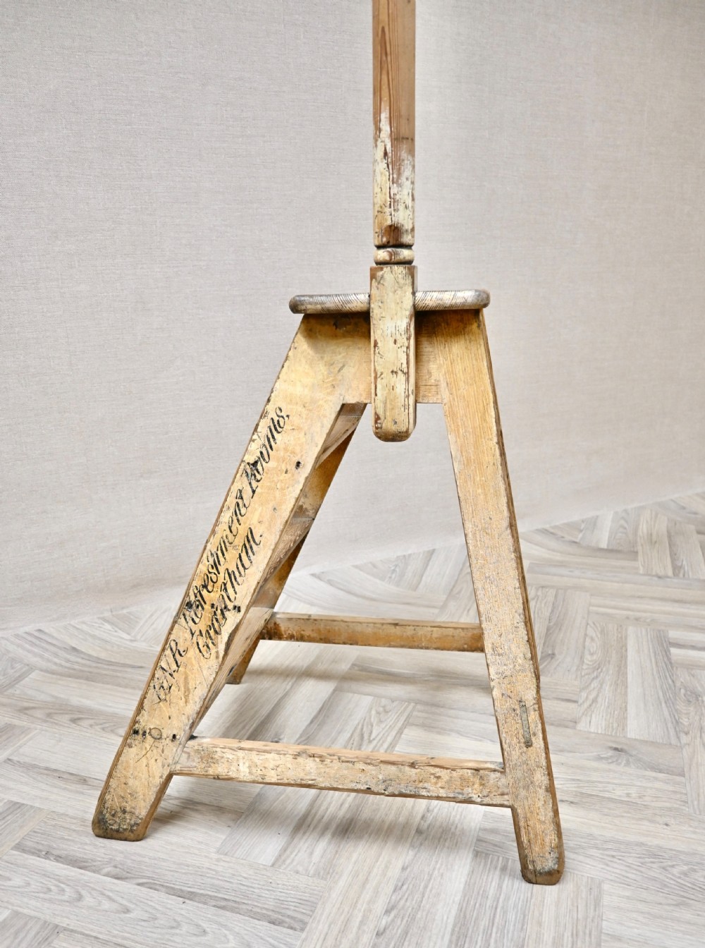 Light pine wooden step ladder featuring an extended vertical handrail pole and hand-painted black lettering along the side frame. View II