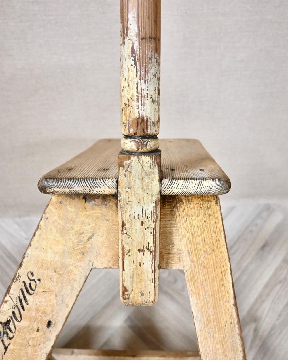 Light pine wooden step ladder featuring an extended vertical handrail pole and hand-painted black lettering along the side frame. View VII