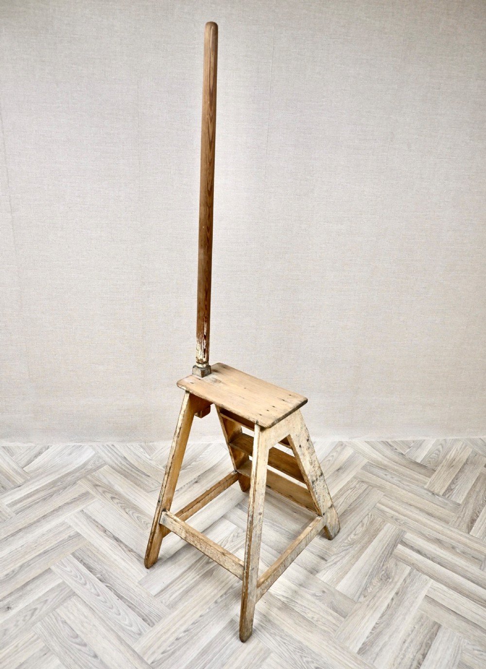 Light pine wooden step ladder featuring an extended vertical handrail pole and hand-painted black lettering along the side frame. View VIII