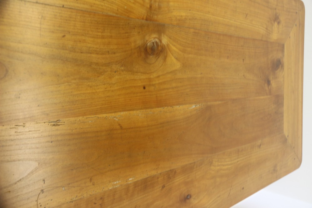An antique French cherrywood farmhouse dining table featuring slender cabriole legs, an end drawer, and an extending pull-out slide. View VI