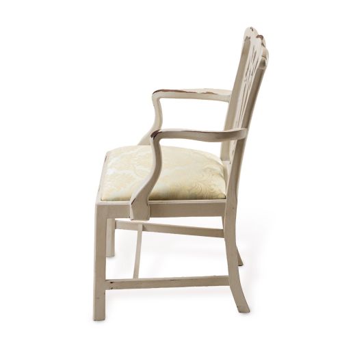 fig 3. A Georgian Chippendale style armchair featuring an off-white painted finish with visible distressing, a pierced back splat, and a patterned fabric seat.