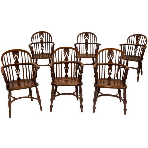 MATCHED SET OF SIX EARLY 19TH CENTURY ENGLISH YEW ELM WINDSOR ARMCHAIRS WITH CRINOLINE STRETCHERS C18201840