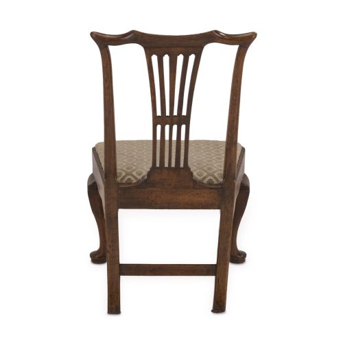 fig 2. A mid-18th century English walnut side chair featuring a vertical pierced splat backrest, drop-in upholstered seat, and front cabriole legs.