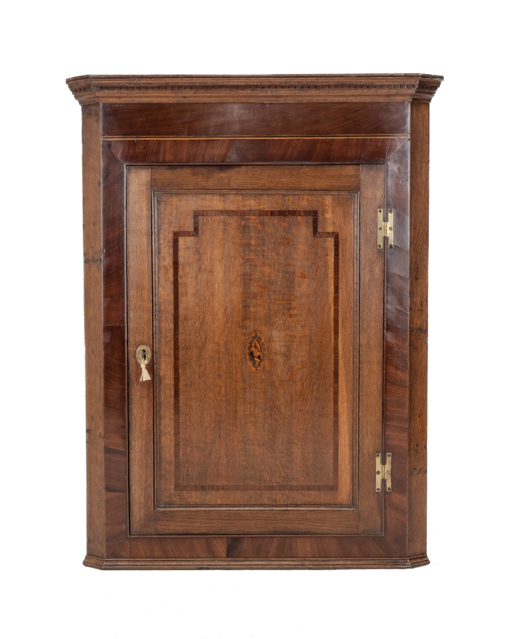 A late 18th-century Georgian oak wall-hanging corner cupboard featuring mahogany crossbanding, an inlaid central lozenge motif, a moulded top cornice, and brass H-hinges. View II