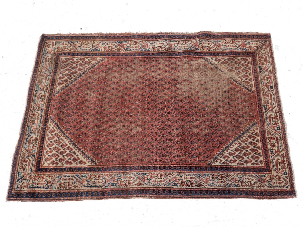A rectangular late 19th-century handwoven Persian Mir Seraband rug featuring a repeating boteh pattern in terracotta red, blue, and cream. View VI