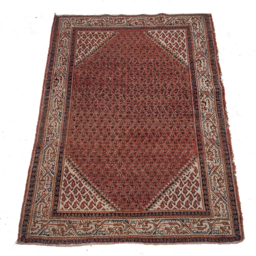 A rectangular late 19th-century handwoven Persian Mir Seraband rug featuring a repeating boteh pattern in terracotta red, blue, and cream. View VIII