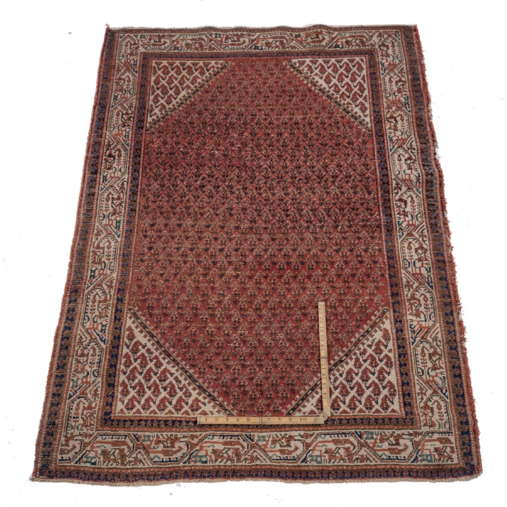 A rectangular late 19th-century handwoven Persian Mir Seraband rug featuring a repeating boteh pattern in terracotta red, blue, and cream. View IX