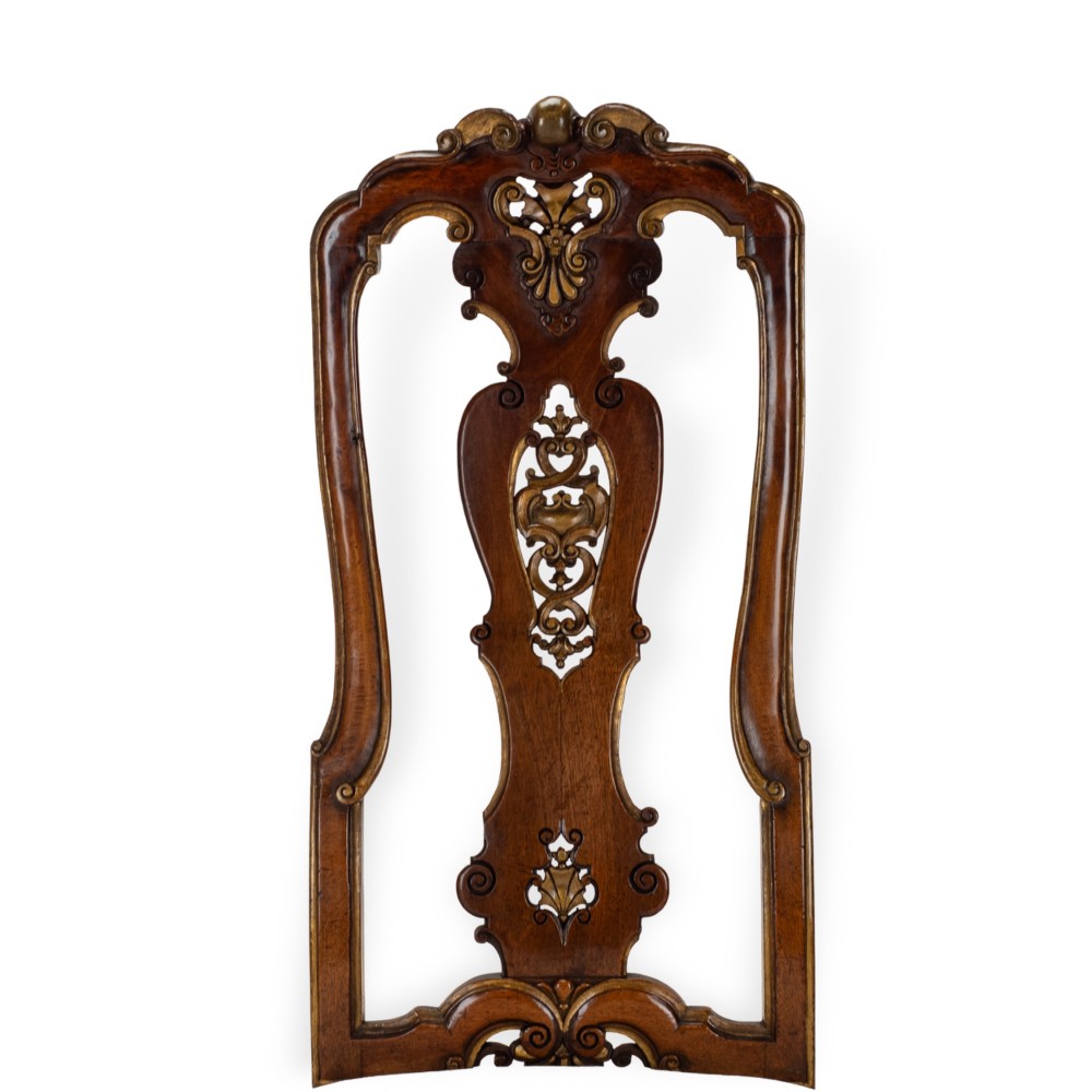 A set of six tall carved walnut dining chairs featuring gilt highlights, pierced splats, and white fabric drop-in seats. View VII