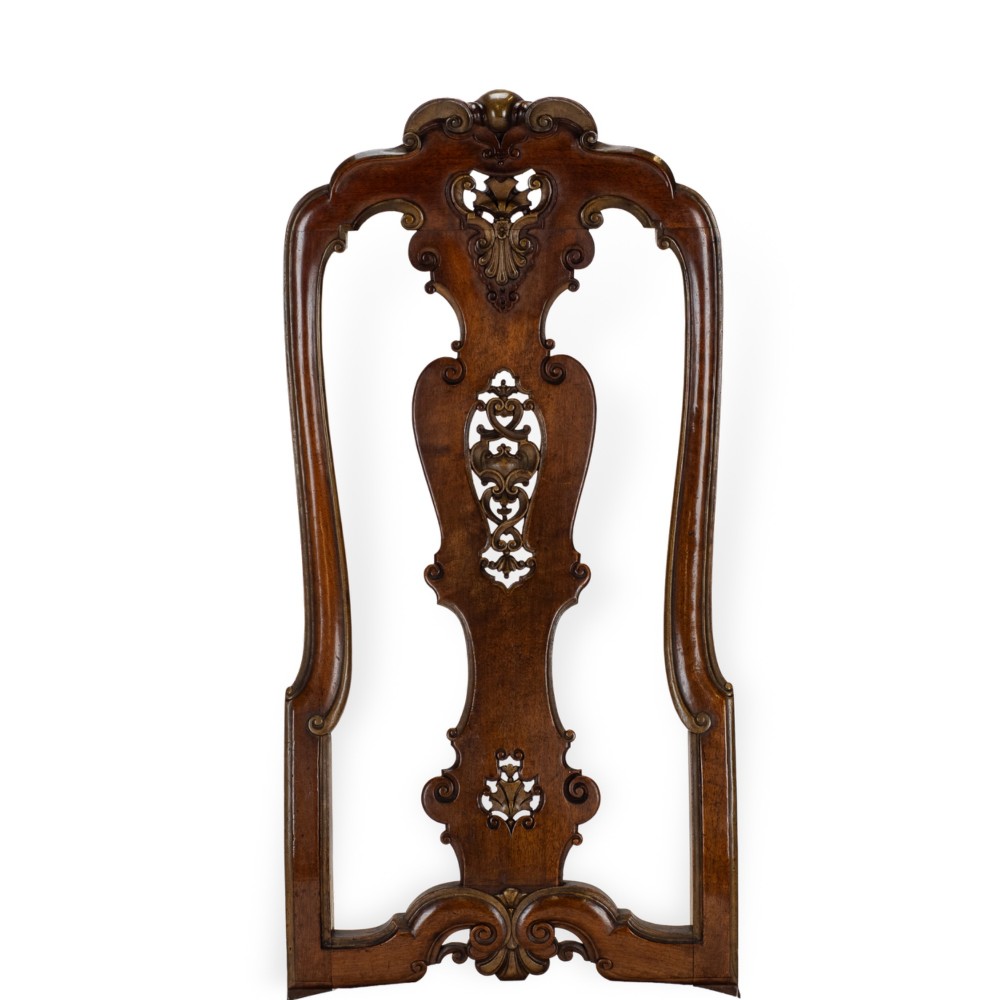 A set of six tall carved walnut dining chairs featuring gilt highlights, pierced splats, and white fabric drop-in seats. View IX