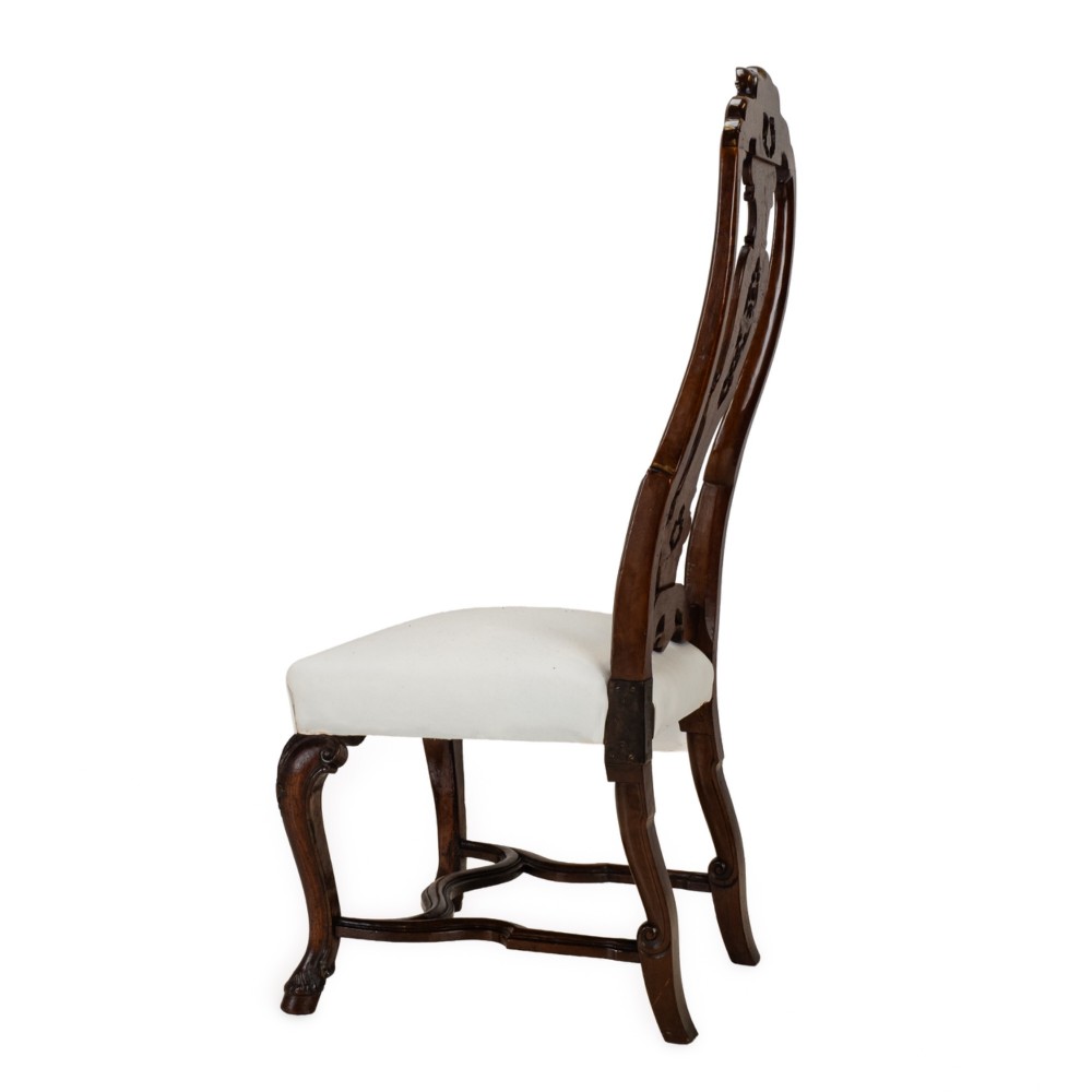 A set of six tall carved walnut dining chairs featuring gilt highlights, pierced splats, and white fabric drop-in seats. View XI