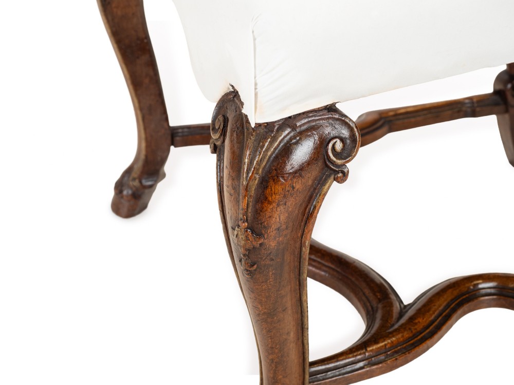 A set of six tall carved walnut dining chairs featuring gilt highlights, pierced splats, and white fabric drop-in seats. View XII