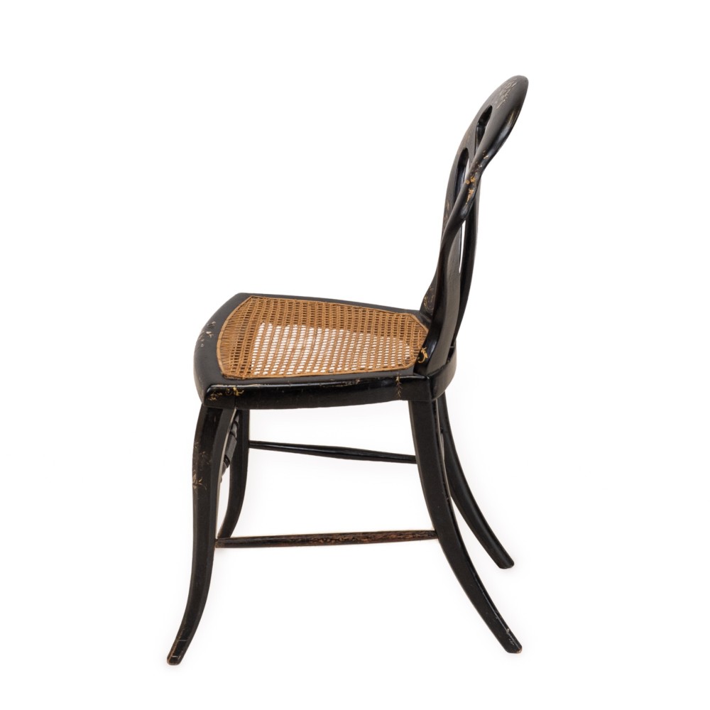 A black japanned papier-mache side chair with mother-of-pearl floral inlay, gold leaf flourishes, a openwork backrest, cabriole front legs, and a woven cane seat. View XI