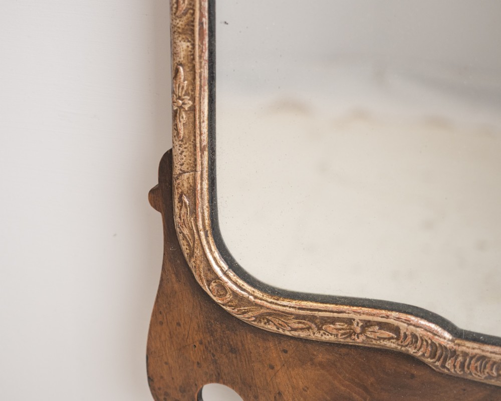 A George II style walnut fretwork pier mirror featuring a carved parcel-gilt hoho bird motif on the crest and a gilded inner moulding. View V