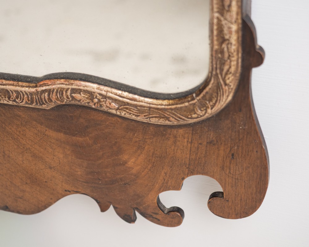 A George II style walnut fretwork pier mirror featuring a carved parcel-gilt hoho bird motif on the crest and a gilded inner moulding. View VI