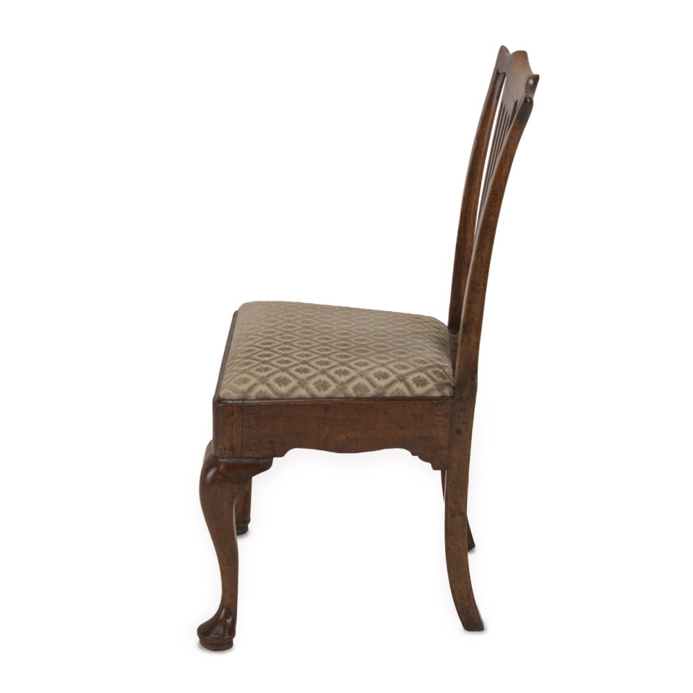 A mid-18th century English walnut side chair featuring a pierced vertical splat back, patterned upholstered seat, and cabriole front legs. View II