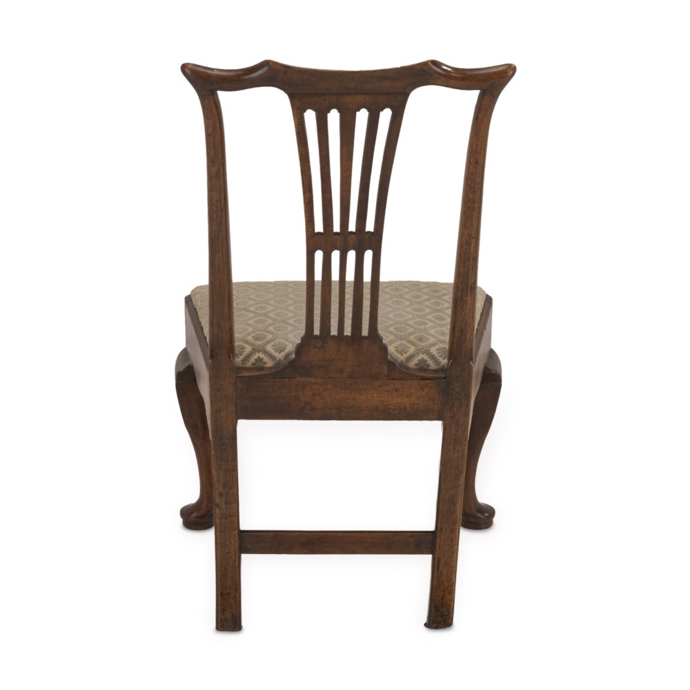 A mid-18th century English walnut side chair featuring a pierced vertical splat back, patterned upholstered seat, and cabriole front legs. View III