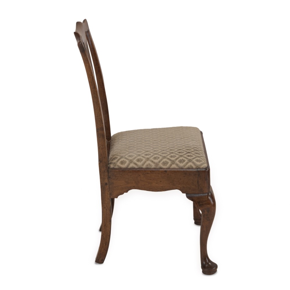 A mid-18th century English walnut side chair featuring a pierced vertical splat back, patterned upholstered seat, and cabriole front legs. View IV