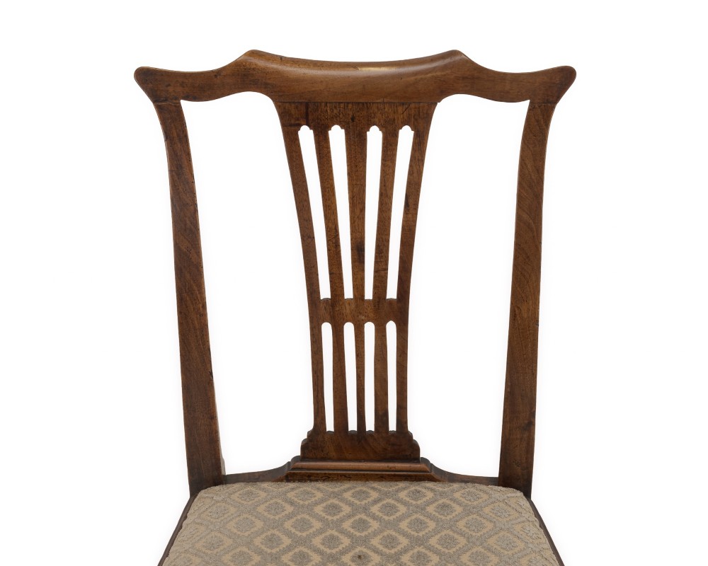 A mid-18th century English walnut side chair featuring a pierced vertical splat back, patterned upholstered seat, and cabriole front legs. View VI