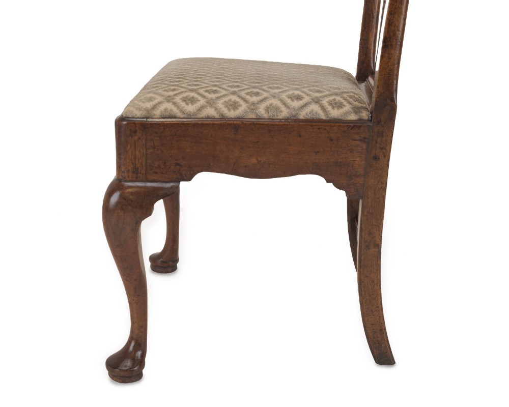 A mid-18th century English walnut side chair featuring a pierced vertical splat back, patterned upholstered seat, and cabriole front legs. View X