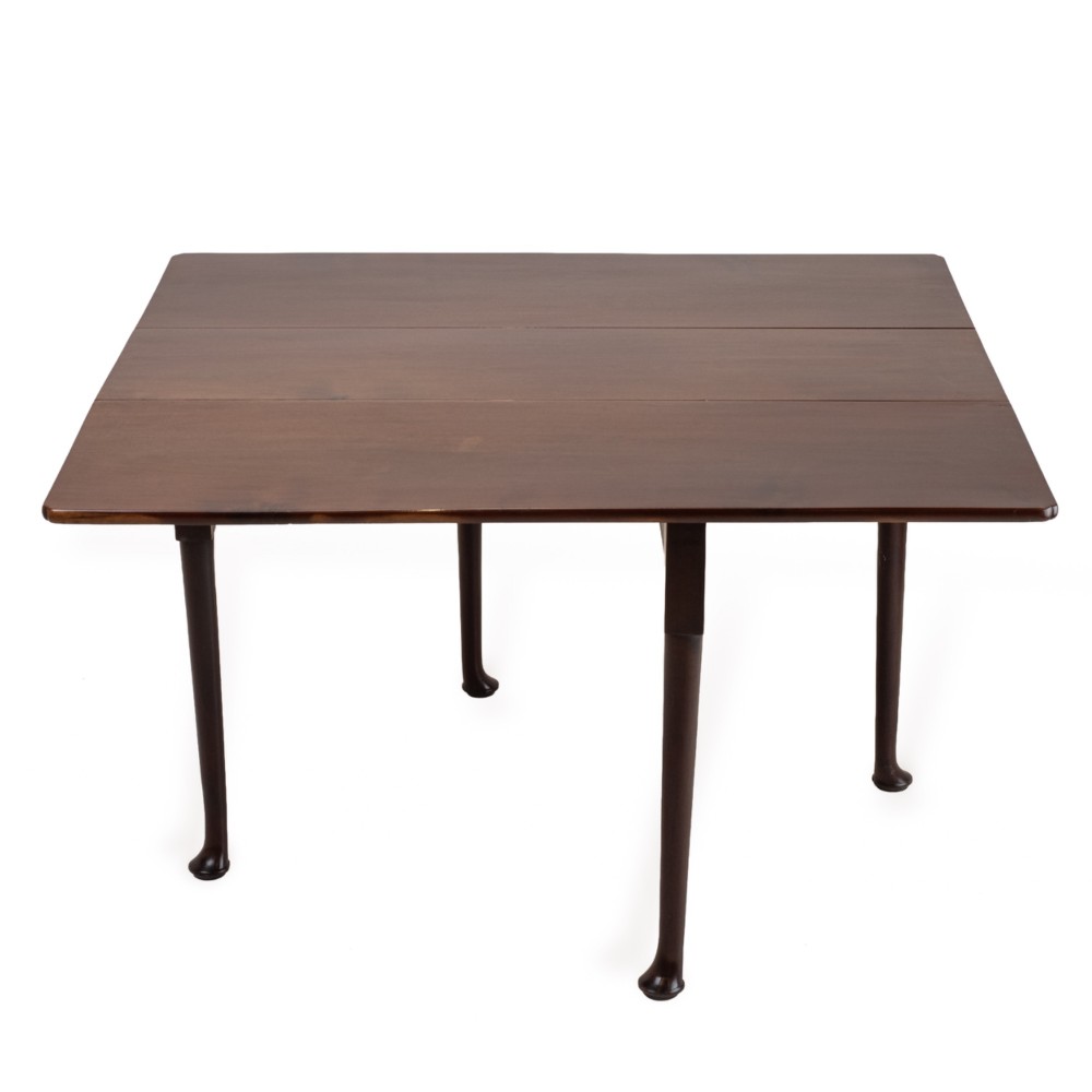 An antique dark walnut drop-leaf gateleg table shown with both extension leaves fully raised and slender turned legs. View III