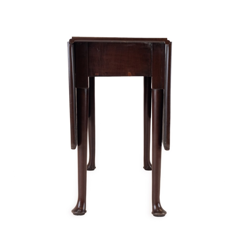 An antique dark walnut drop-leaf gateleg table shown with both extension leaves fully raised and slender turned legs. View IX