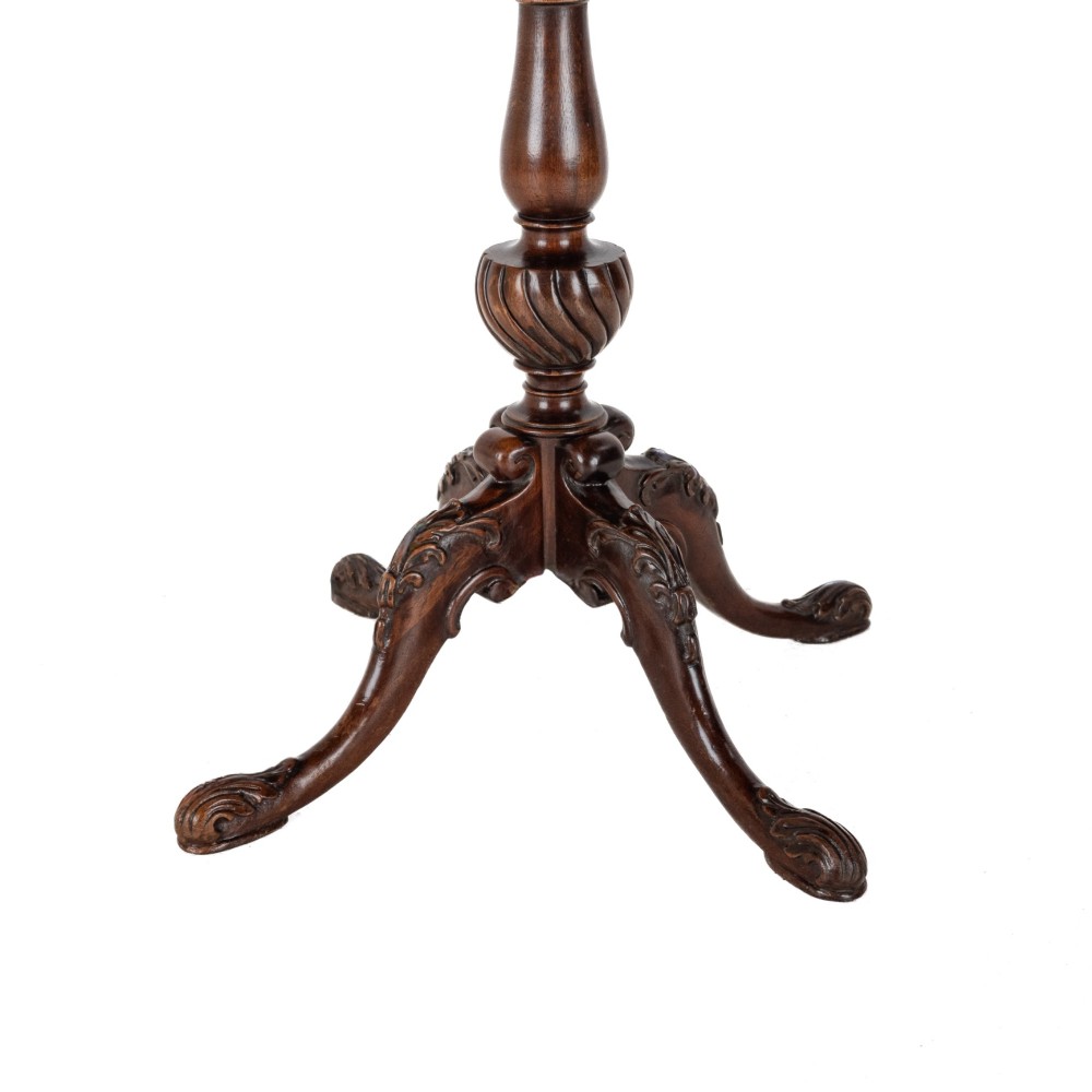 A Chippendale Revival mahogany wine table featuring a green leather top, a piecrust border, a carved central pedestal, and a carved tripod base. View IV