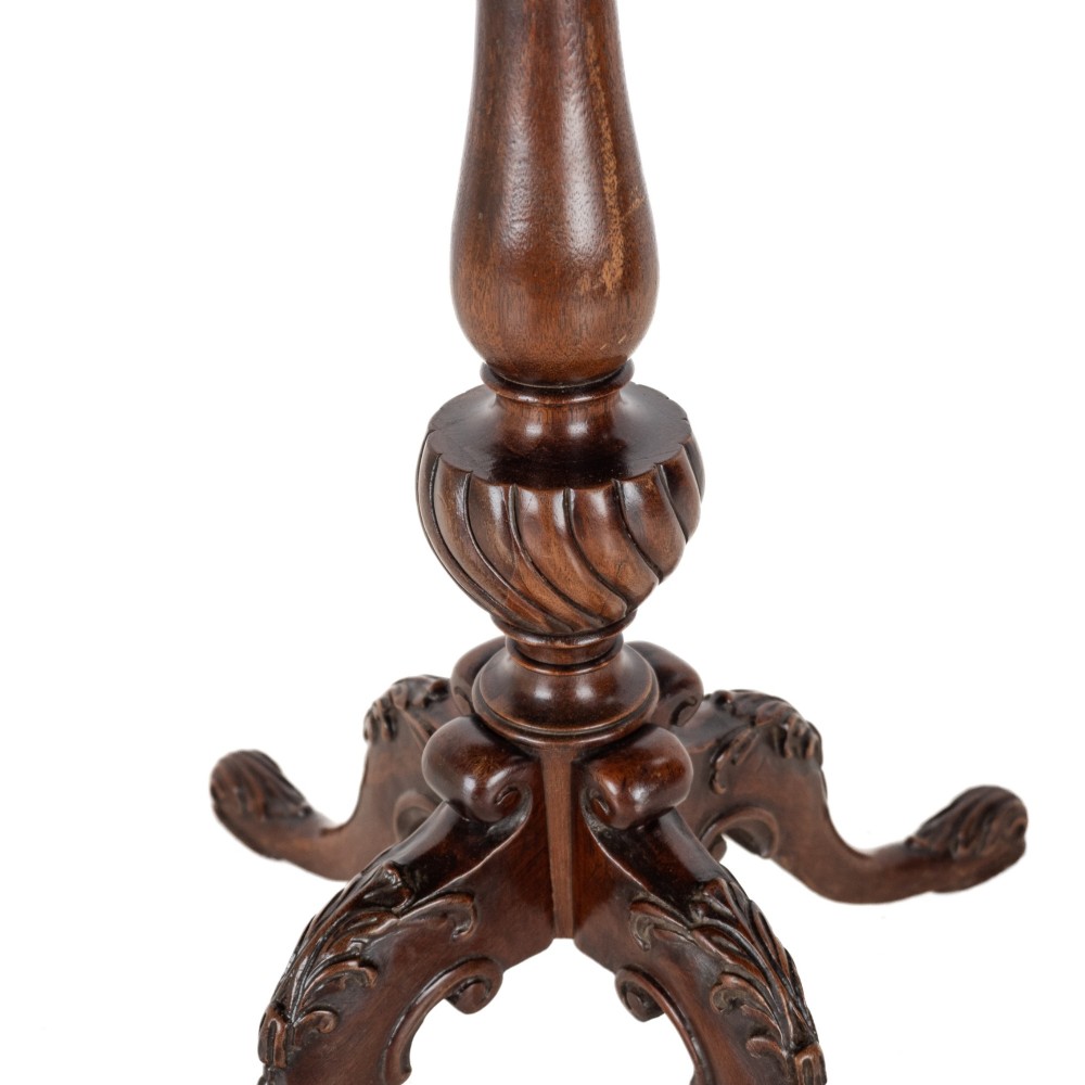 A Chippendale Revival mahogany wine table featuring a green leather top, a piecrust border, a carved central pedestal, and a carved tripod base. View VII