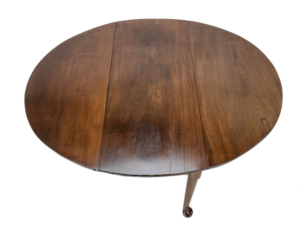 A George II mid-18th century dark mahogany oval drop-leaf table with slender legs ending in pad feet. View III