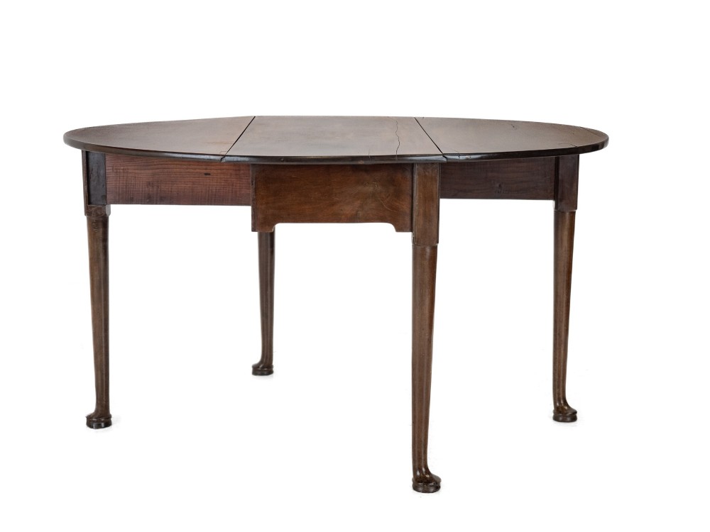 A George II mid-18th century dark mahogany oval drop-leaf table with slender legs ending in pad feet. View IV